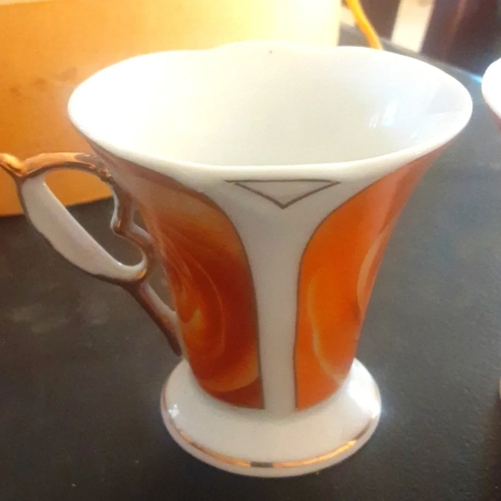 Set of Red and Orange Decorative Cups